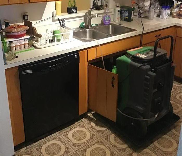 Dehumidifier set up in kitchen.